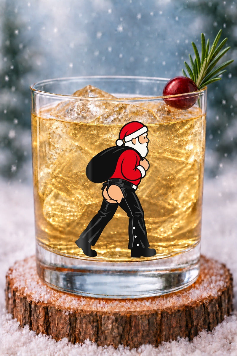 Nauti Claus Chaps 14 oz rocks glass with Santa in leather chaps heading out with his sack