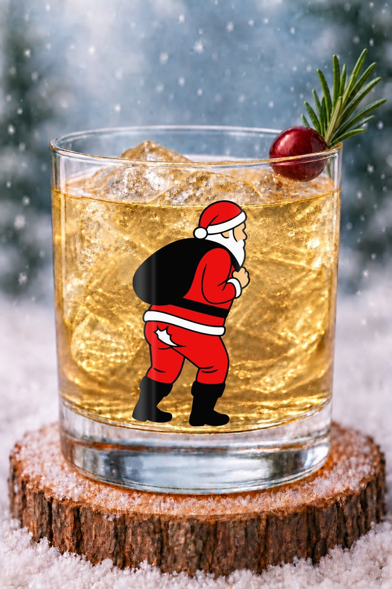 Nauti Claus Crack of Dawn 14 oz rocks glass with Santa in red pants with a star cutout on his backside