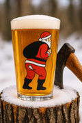 Nauti Claus Crack of Dawn 16 oz pint glass printed with Santa with his sack and his pants sagging to show a cheeky butt crack