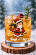 Nauti Claus Holi-Flogger 10 oz rocks glass printed with a "Sleigh All Day" slogan