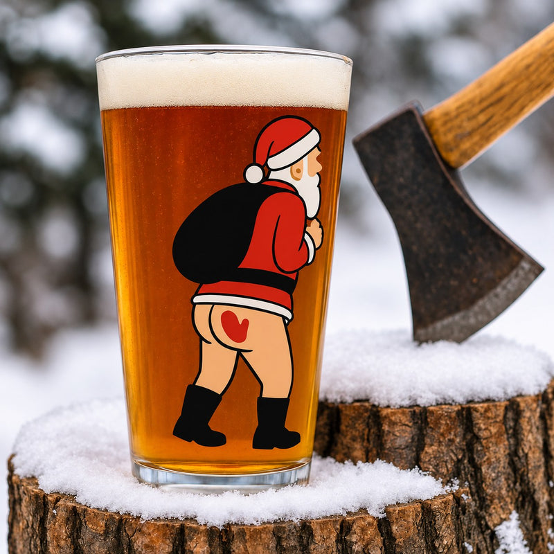 Nauti Claus Spanked 16 oz pint glass printed with cheeky Santa with his sack and a red handprint on his bare bottom